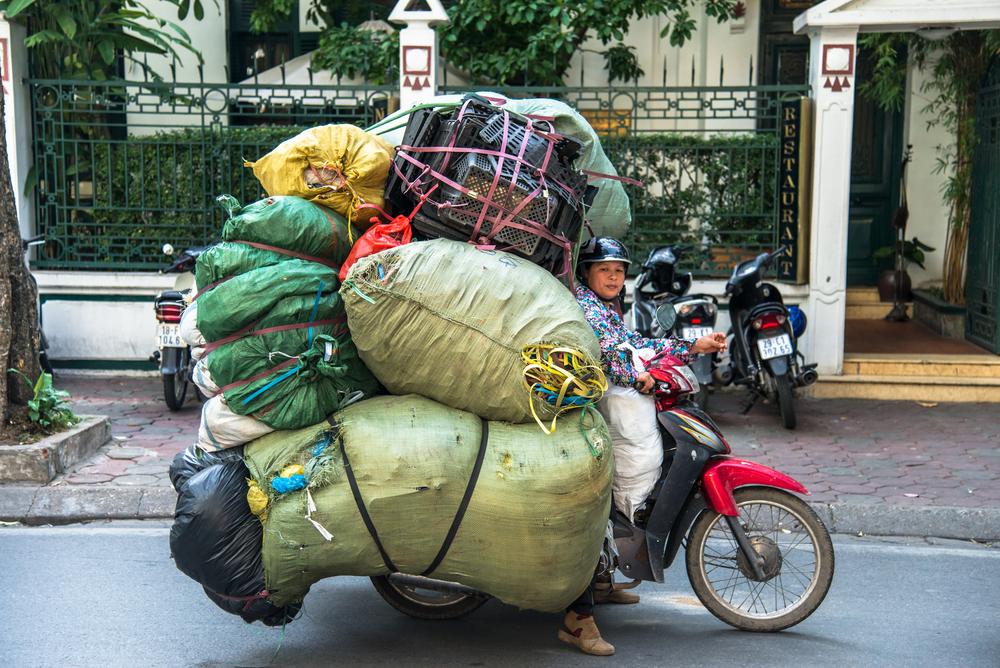 Hanoi,,Vietnam,,Nov,17,,2013:,Unidentified,Woman,Drives,Overloaded,Motorcycle