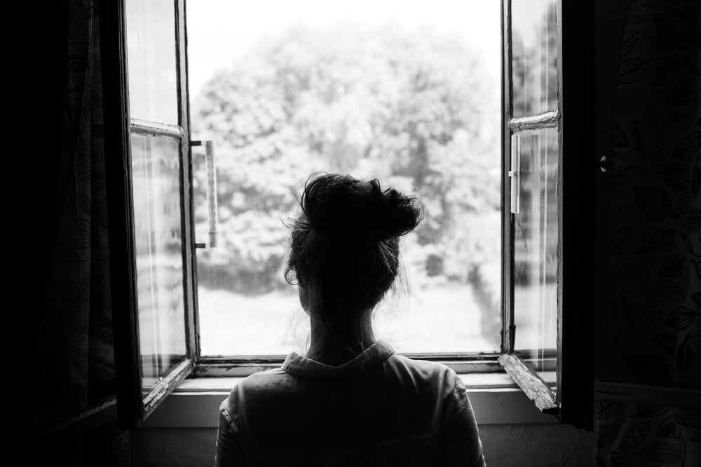 Woman,Looking,Through,The,Old,Window,On,The,Garden,Or