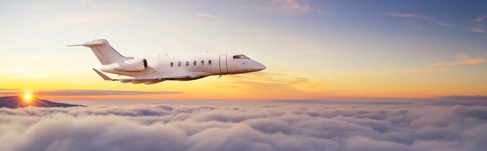 Private,Passengers,Jetliner,Flying,Above,Clouds,In,Sunset,Light.,Concept