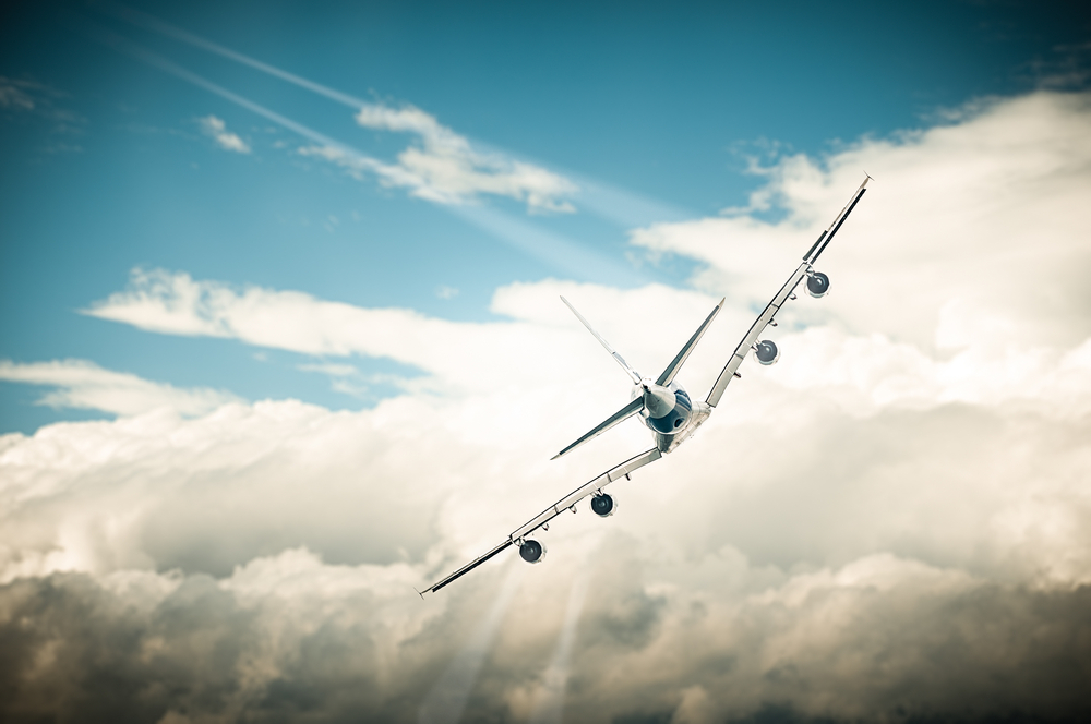 Beautiful,View,Of,White,Plane,And,Blue,Sky,With,Clouds