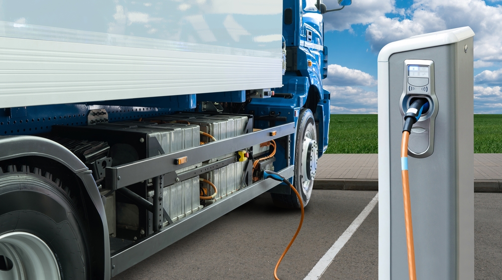 Electric,Truck,Batteries,Are,Charged,From,The,Charging,Station.,Concept