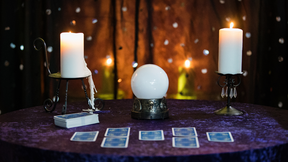 Fortune Telling Table with a crystal ball and tarot cards