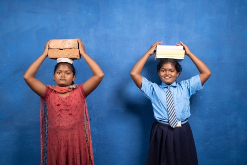 Two,Girl,Kids,With,Books,And,Bricks,On,Each,Other