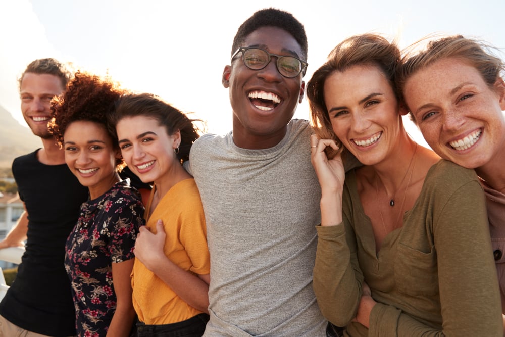 Portrait,Of,Smiling,Young,Friends,Walking,Outdoors,Together