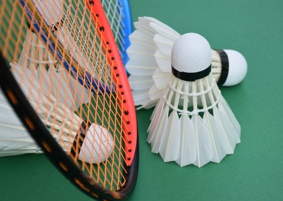 White,Cream,Badminton,Shuttlecocks,,Badminton,Rackets,On,Green,Floor,Of