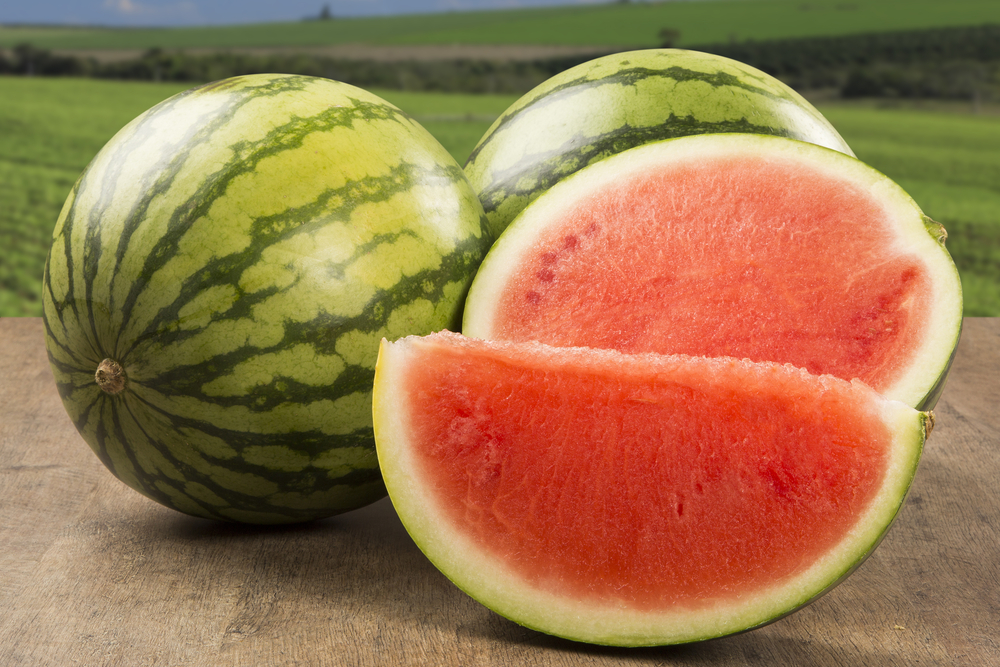 Ripe,Watermelons,On,Wicker,Tray,On,Table,On,Wooden,Background