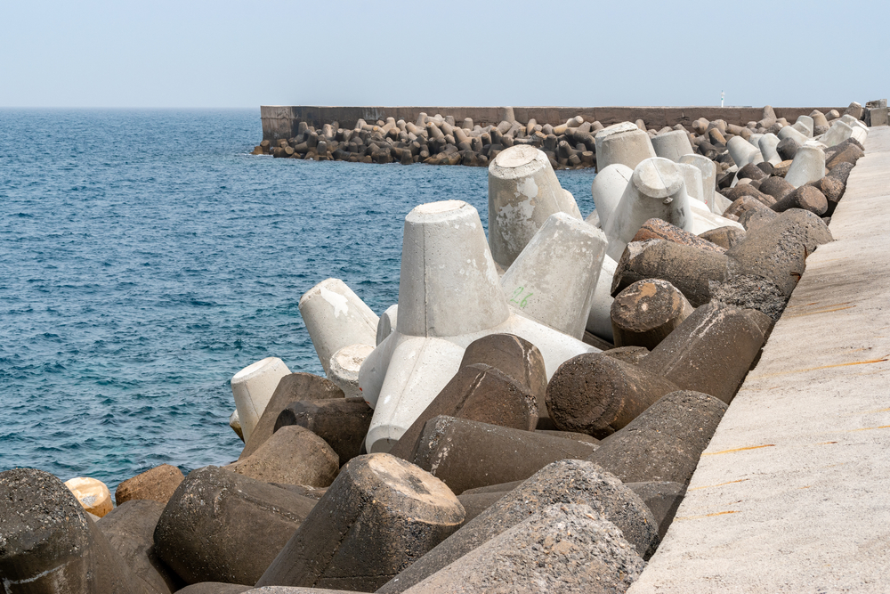 Breakwater,Protection,Under,Blue,Sky,,Solid,Concrete,Blocks,In,Port