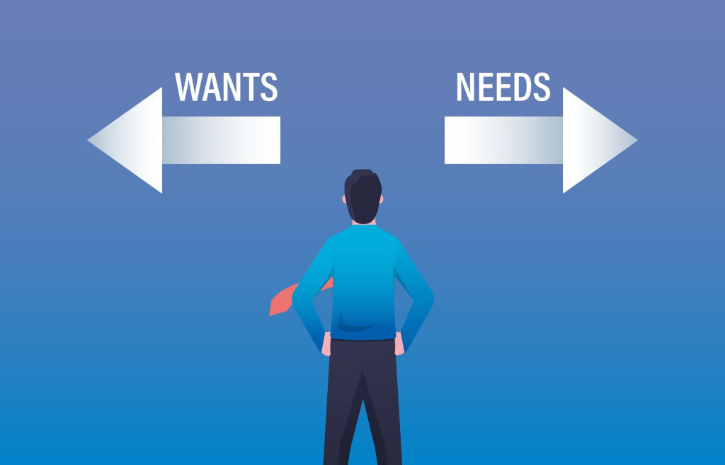 Businessman dilemma choice between wants and needs