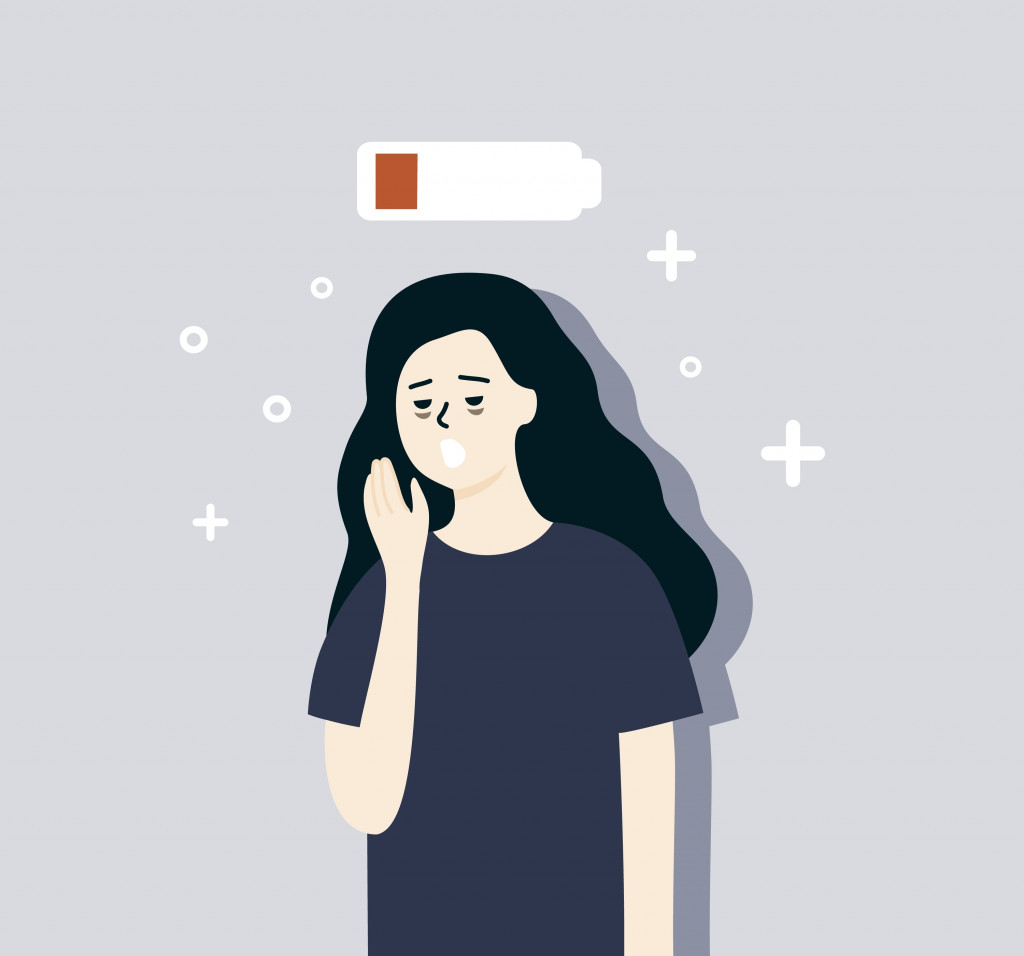 Tired woman with low battery above head