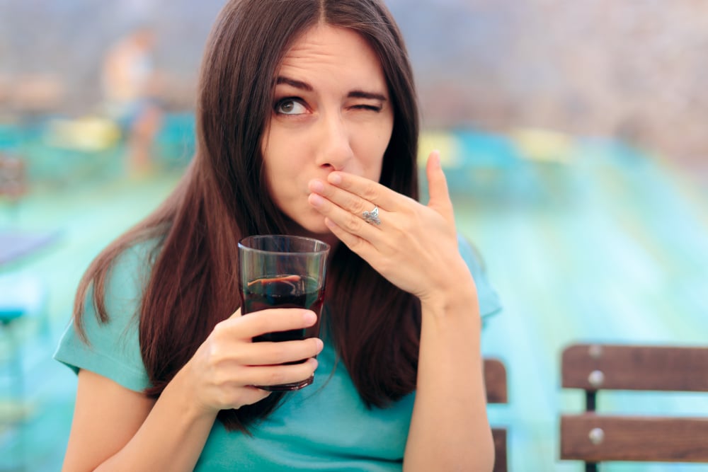 Woman,Reacting,After,Having,A,Fizzy,Soda,Drink.,Funny,Female