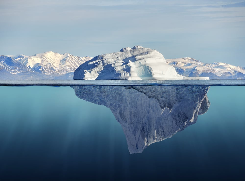 Iceberg,With,Above,And,Underwater,View,Taken,In,Greenland