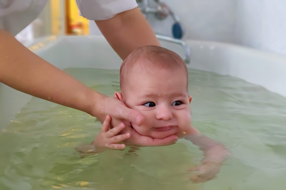 Infant,Baby,In,Special,Pool,With,Doctor,Trainer,Instructor.,Newborn