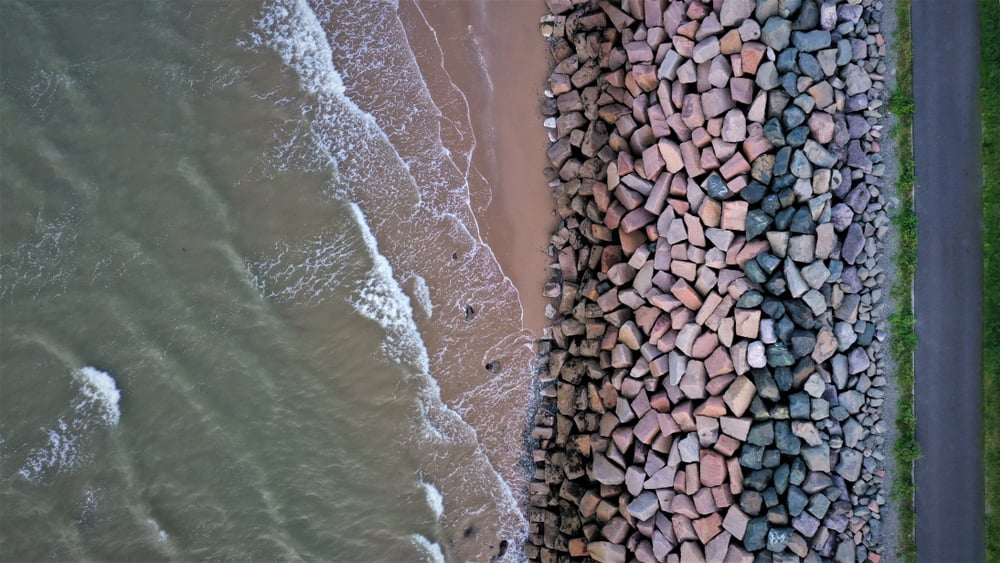 An,Aerial,Shot,Of,The,Sea,Level,Defenses,On,Penmaenmawr