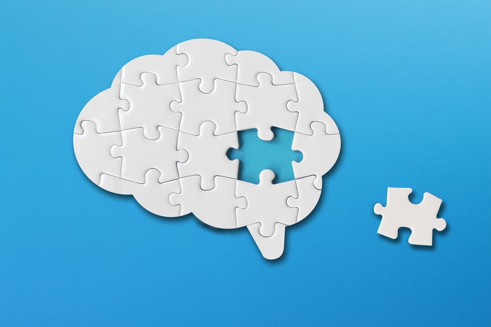 Brain,Shaped,White,Jigsaw,Puzzle,On,Blue,Background,,A,Missing